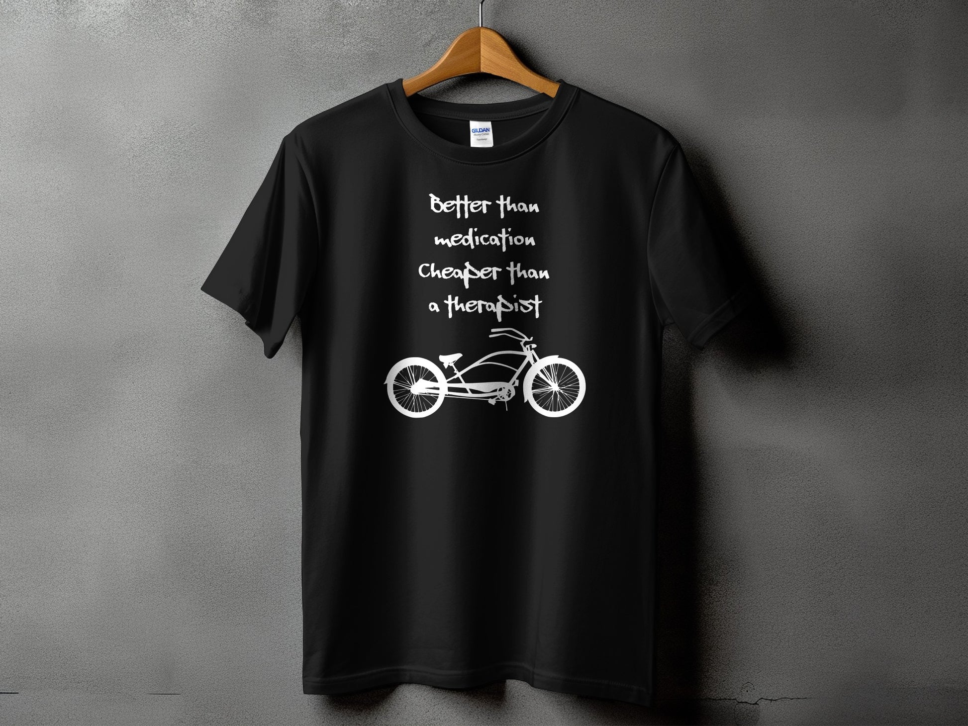 Better than medication, cheaper than a therapist text above cruiser bicycle silhouette on a Gildan 5000 t-shirt